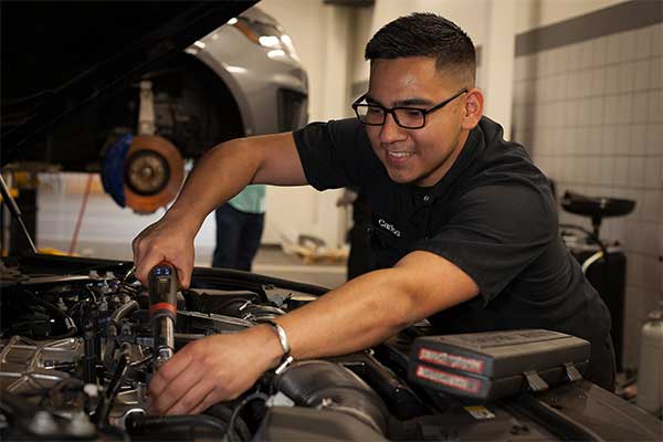 Automotive technician working on a vehicle